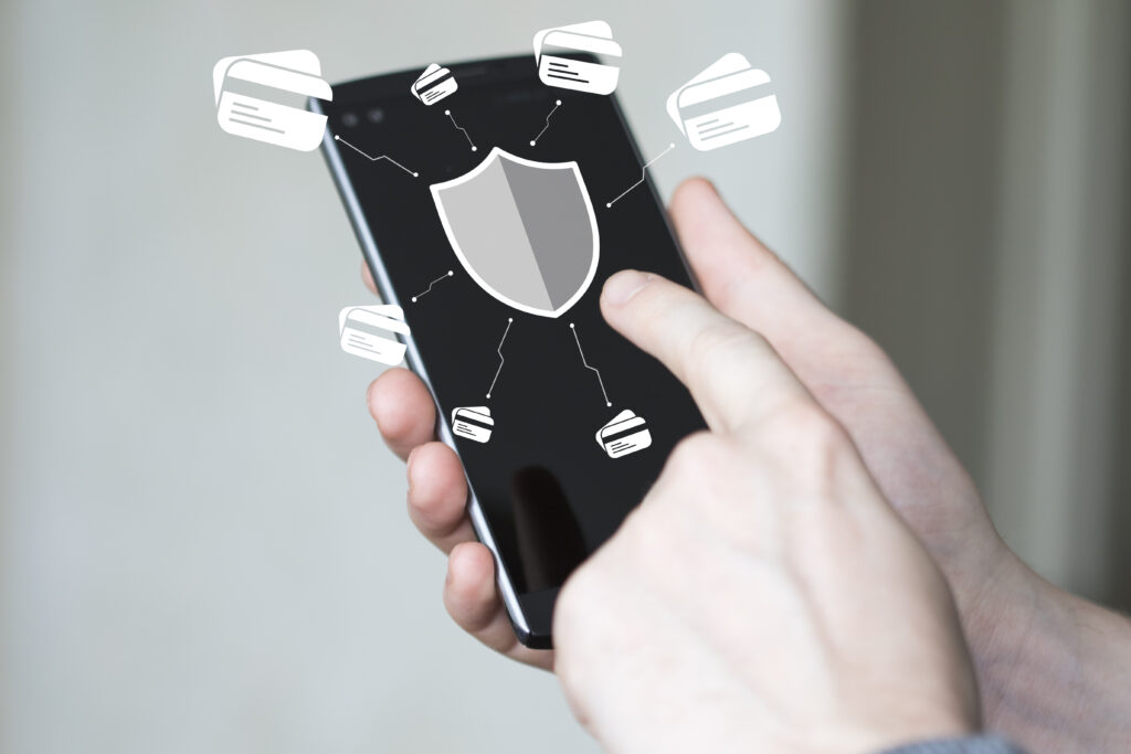 Businessman,Pressing,Button,Security,Shield,Virus,Credit,Card,Phone