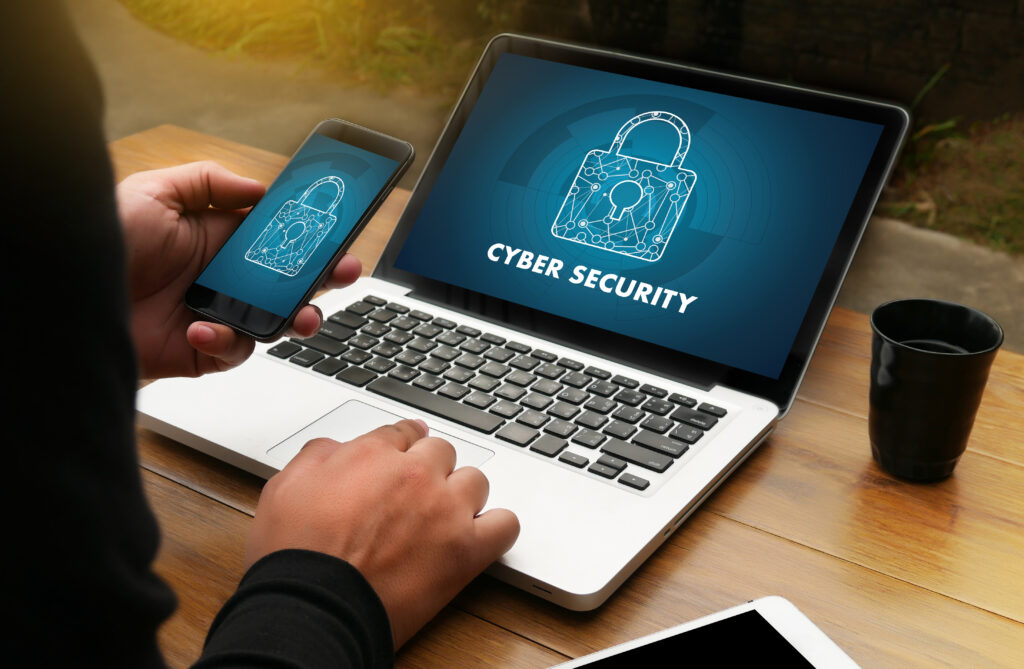 Cyber,Security,Business,,Technology,firewallantivirus,Alert,Protection,Security,And,Cyber,Security Cyber Security: Man using an authenticator app to access his laptop.